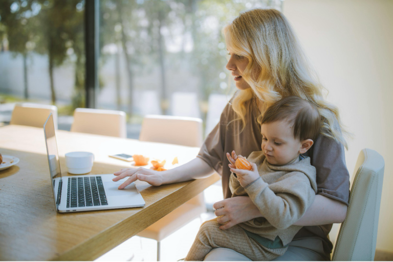 Young mum using laptop